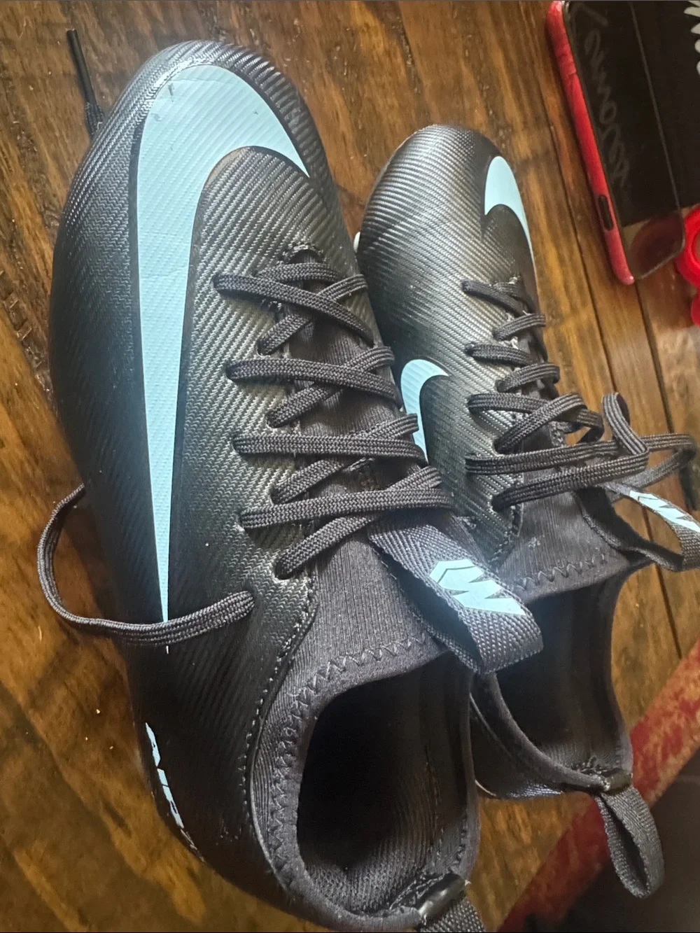 Nike Black Cleats with Light Blue Swoosh